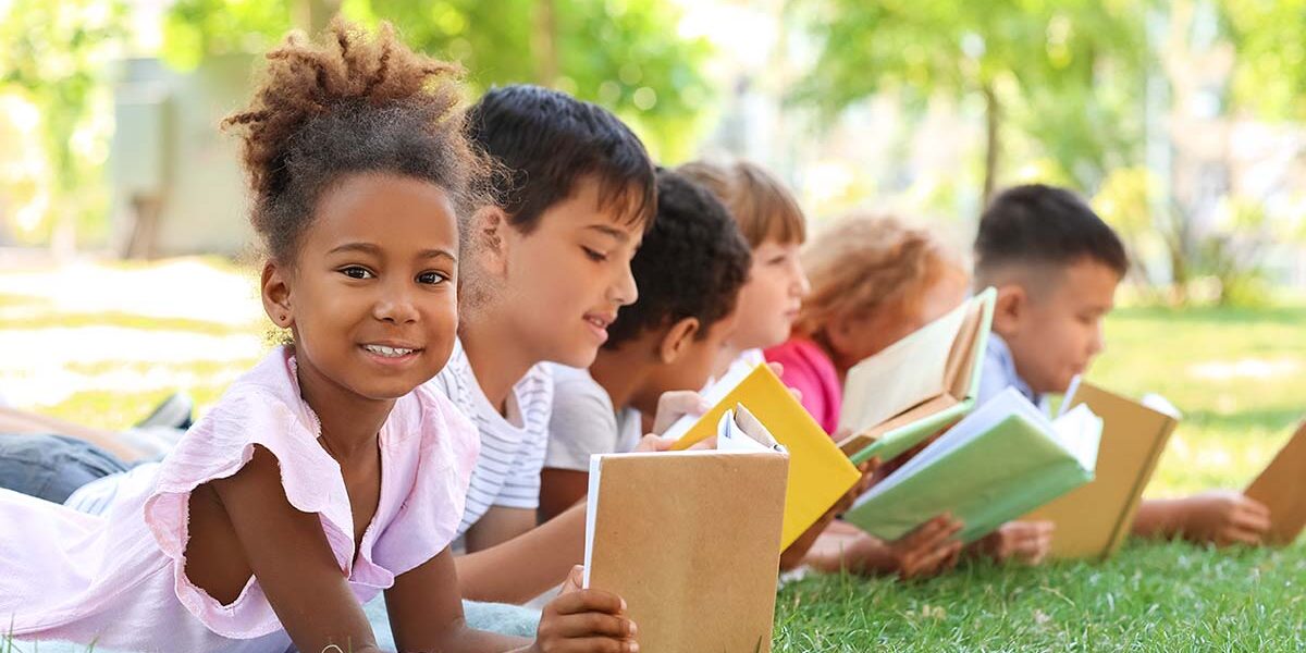 Children reading books at school