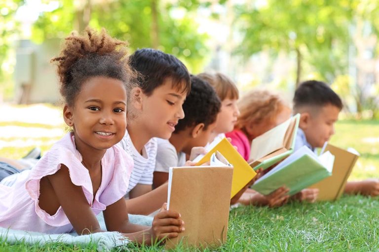 Children reading books at school