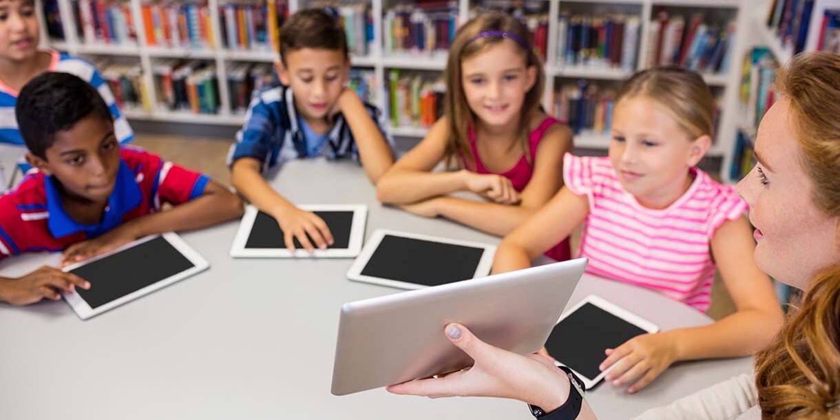 children with their computer tablets