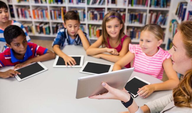 children with their computer tablets